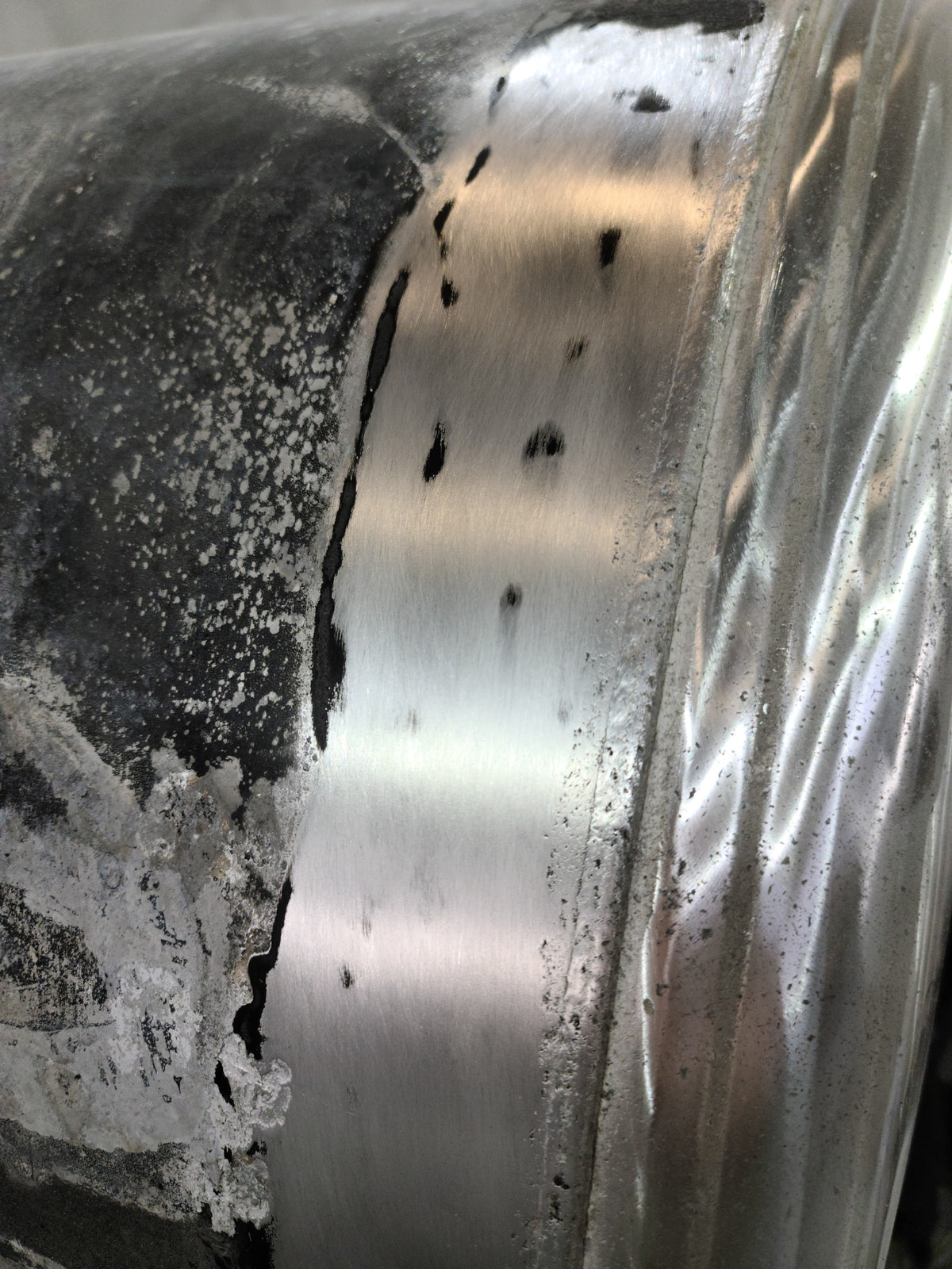 Adhesive and silicone removed with gentle, dry abrasive action (120 grit).