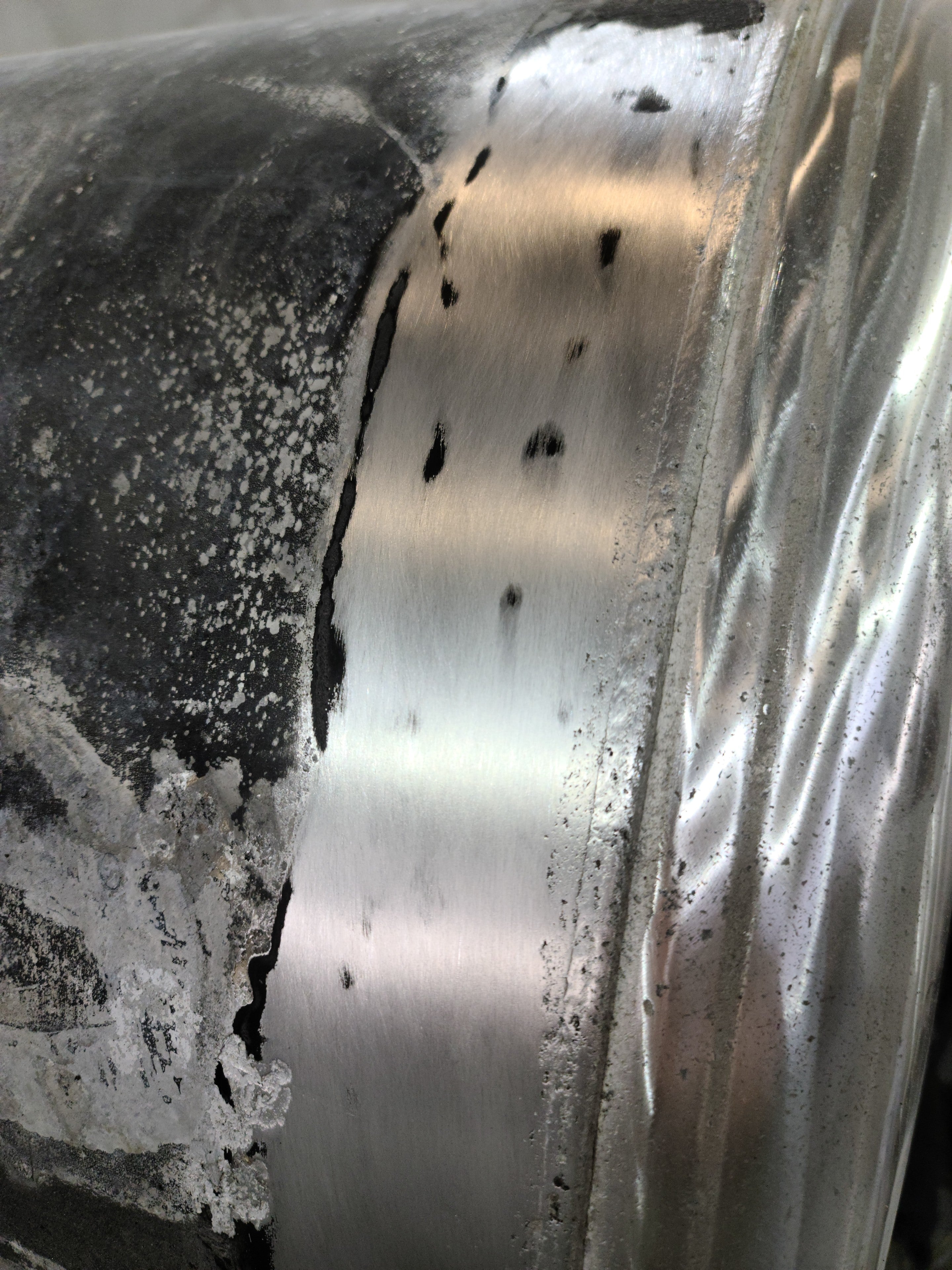 Adhesive and silicone removed with gentle, dry abrasive action (120 grit).