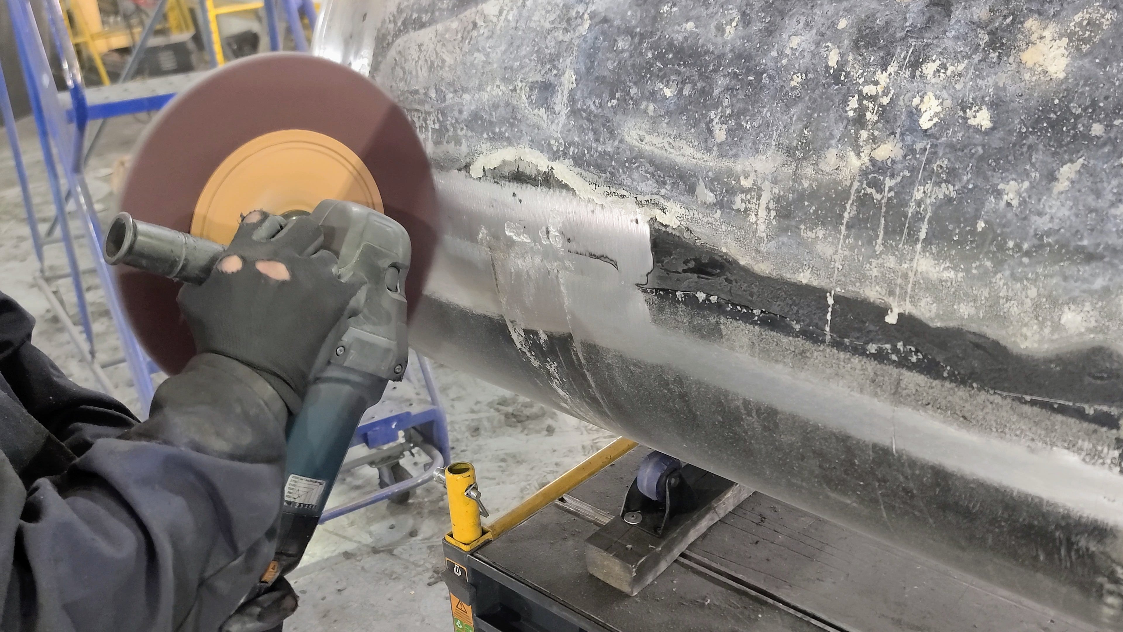 Adhesive and silicone removed with more aggressive, dry abrasive action (120 grit).